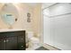 Bathroom featuring a white sink, toilet, and walk-in shower at 1425 Chatfield Pl, Orlando, FL 32814