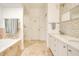 Bathroom featuring a white sink with tile accent wall at 1425 Chatfield Pl, Orlando, FL 32814