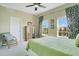 Bedroom with windows, curtains, ceiling fan, and sitting area at 1425 Chatfield Pl, Orlando, FL 32814