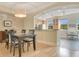 Traditional dining area connected to kitchen with wood floors and neutral paint at 1425 Chatfield Pl, Orlando, FL 32814