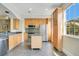 Bright kitchen features stainless steel appliances, light wood cabinets, and a movable island at 1425 Chatfield Pl, Orlando, FL 32814