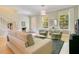 This comfortable living room features hardwood floors, neutral walls, and lots of natural light at 1425 Chatfield Pl, Orlando, FL 32814