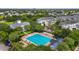 A birds eye view of a community pool with trees surrounding the lounge chairs at 1425 Chatfield Pl, Orlando, FL 32814
