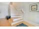 Staircase featuring wood and carpeted steps at 1425 Chatfield Pl, Orlando, FL 32814