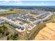 New homes construction in a Primary planned community featuring modern architecture and landscaping at 14613 Erice Ave, Clermont, FL 34714