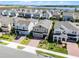 Stunning aerial view showcasing the home's prime location in a scenic neighborhood near the water at 14613 Erice Ave, Clermont, FL 34714