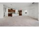 Open concept kitchen with wood cabinets, granite counters, stainless appliances, and center island at 14613 Erice Ave, Clermont, FL 34714