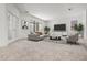 Expansive living room showcasing modern furnishings and natural light from sliding glass doors at 14613 Erice Ave, Clermont, FL 34714