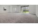 Large living area with expansive sliding glass doors leading to the backyard at 14613 Erice Ave, Clermont, FL 34714