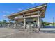 Outdoor bar area with seating under a covered patio at 1518 Rolling Fairway Dr, Davenport, FL 33896
