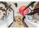 A shared ' bedroom with a fun animal mural and two twin beds with colorful decorative pillows at 1518 Rolling Fairway Dr, Davenport, FL 33896