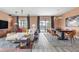 Bright living area with modern decor, dining area, contemporary lighting, and backyard pool view at 1518 Rolling Fairway Dr, Davenport, FL 33896