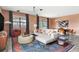 Bright living area with modern decor, dining area, contemporary lighting, and backyard pool view at 1518 Rolling Fairway Dr, Davenport, FL 33896