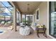Inviting outdoor patio with cozy seating, a grill, lush plants, and views of the sparkling pool at 1518 Rolling Fairway Dr, Davenport, FL 33896