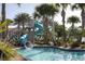 Waterpark-style pool complete with a thrilling waterslide, lush landscaping, and plenty of space for relaxation at 1518 Rolling Fairway Dr, Davenport, FL 33896
