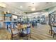 Spacious restaurant area featuring comfortable seating, a fully stocked bar, and scenic views at 1518 Rolling Fairway Dr, Davenport, FL 33896