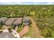Aerial view of modern homes, showcasing architectural design, solar panels and landscaping at 1559 Scrub Jay Ct, Deland, FL 32724