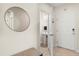 Entryway featuring a half-bathroom with a pedestal sink and classic tile flooring at 1559 Scrub Jay Ct, Deland, FL 32724