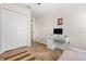 Spare bedroom with light walls, wood-look flooring, and a dedicated desk/workspace at 1559 Scrub Jay Ct, Deland, FL 32724