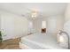 Bedroom showcasing a neutral color scheme, ceiling fan, and an ensuite bathroom at 1559 Scrub Jay Ct, Deland, FL 32724