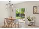 Bright dining area features patio access and modern decor at 1559 Scrub Jay Ct, Deland, FL 32724