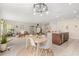 Eat-in kitchen and dining area featuring a modern chandelier and sliding glass doors to the backyard patio at 1559 Scrub Jay Ct, Deland, FL 32724