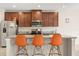 Modern kitchen featuring granite countertops, stainless steel appliances, and a central island with barstool seating at 1559 Scrub Jay Ct, Deland, FL 32724