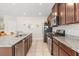 Stylish kitchen features granite countertops, stainless steel appliances, and ample cabinet space at 1559 Scrub Jay Ct, Deland, FL 32724
