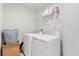 Functional laundry room equipped with a washer, dryer, and shelving for storage at 1559 Scrub Jay Ct, Deland, FL 32724
