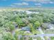 Charming home surrounded by lush trees, with a view of the lake providing a sense of tranquility at 1621 Highland Dr, Longwood, FL 32750
