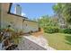 Charming backyard patio and landscaped walkway offer a serene outdoor space at 1621 Highland Dr, Longwood, FL 32750