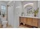 Bathroom featuring a wooden vanity, white countertops, and a shower at 1621 Highland Dr, Longwood, FL 32750
