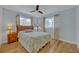 Bedroom featuring neutral walls, hardwood floors, and a fan at 1621 Highland Dr, Longwood, FL 32750