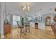 Bright living area featuring hardwood floors, bar seating, and a seamless flow to the modern kitchen at 1621 Highland Dr, Longwood, FL 32750