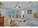Bright main bedroom with hardwood floors and sunroom access at 1621 Highland Dr, Longwood, FL 32750
