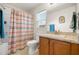 Bright bathroom features a tub and shower combo with a single vanity at 1645 Denali St, Davenport, FL 33837