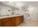 Bathroom features double sinks with wood cabinets and a separate tub and shower at 1645 Denali St, Davenport, FL 33837