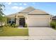 Charming single-Gathering home featuring a well-manicured lawn and attached two-car garage in a desirable neighborhood at 1645 Denali St, Davenport, FL 33837