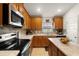 Efficient kitchen layout boasting modern appliances, ample counter space, and a convenient center island at 1645 Denali St, Davenport, FL 33837