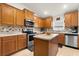 Functional kitchen featuring plenty of cabinet storage, modern appliances, and an island for food preparation at 1645 Denali St, Davenport, FL 33837