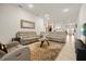Spacious living room offering comfortable seating, neutral color palette, and easy access to the kitchen at 1645 Denali St, Davenport, FL 33837