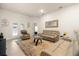 Comfortable living room featuring plush furniture, neutral paint, and a sliding glass door allowing ample natural light at 1645 Denali St, Davenport, FL 33837