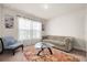 Comfortable living room with stylish seating, area rug, and bright natural light at 1645 Denali St, Davenport, FL 33837