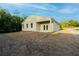 Rear exterior of home showcasing the backyard with space for outdoor activities at 170 Blaine St, Eustis, FL 32726