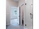 This bathroom features a glass shower door and tile flooring at 170 Blaine St, Eustis, FL 32726