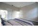 A serene bedroom featuring modern gray flooring and neutral paint at 170 Blaine St, Eustis, FL 32726