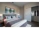 Relaxing bedroom with comfortable bed, stylish linens, and closet at 170 Blaine St, Eustis, FL 32726
