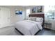 Beautiful bedroom featuring wood-look floors, plush bedding, and bright natural light at 170 Blaine St, Eustis, FL 32726