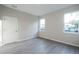 Bright bedroom with ample natural light, wood-look flooring, and neutral paint at 170 Blaine St, Eustis, FL 32726
