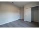 Bedroom featuring wood-look flooring, a closet, and neutral paint at 170 Blaine St, Eustis, FL 32726